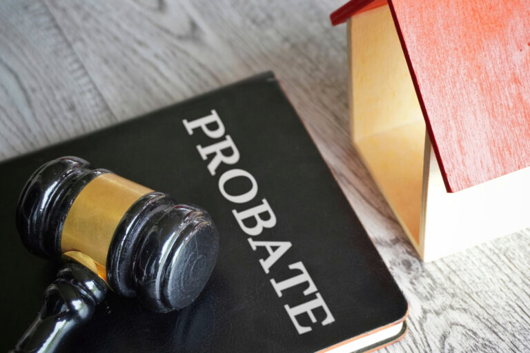 Toy house, gavel and text PROBATE.